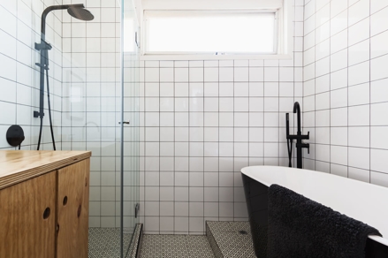 white bathroom with black plumbing fixtures