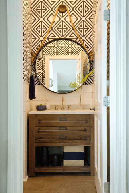 bohemian bathroom with round mirror