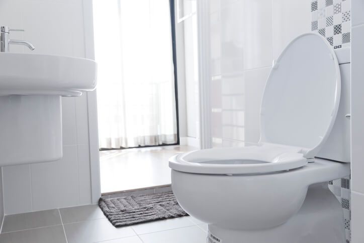 contemporary toilet in white bathroom