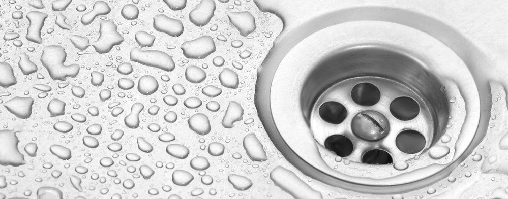 Water going down kitchen drain after drain cleaning service